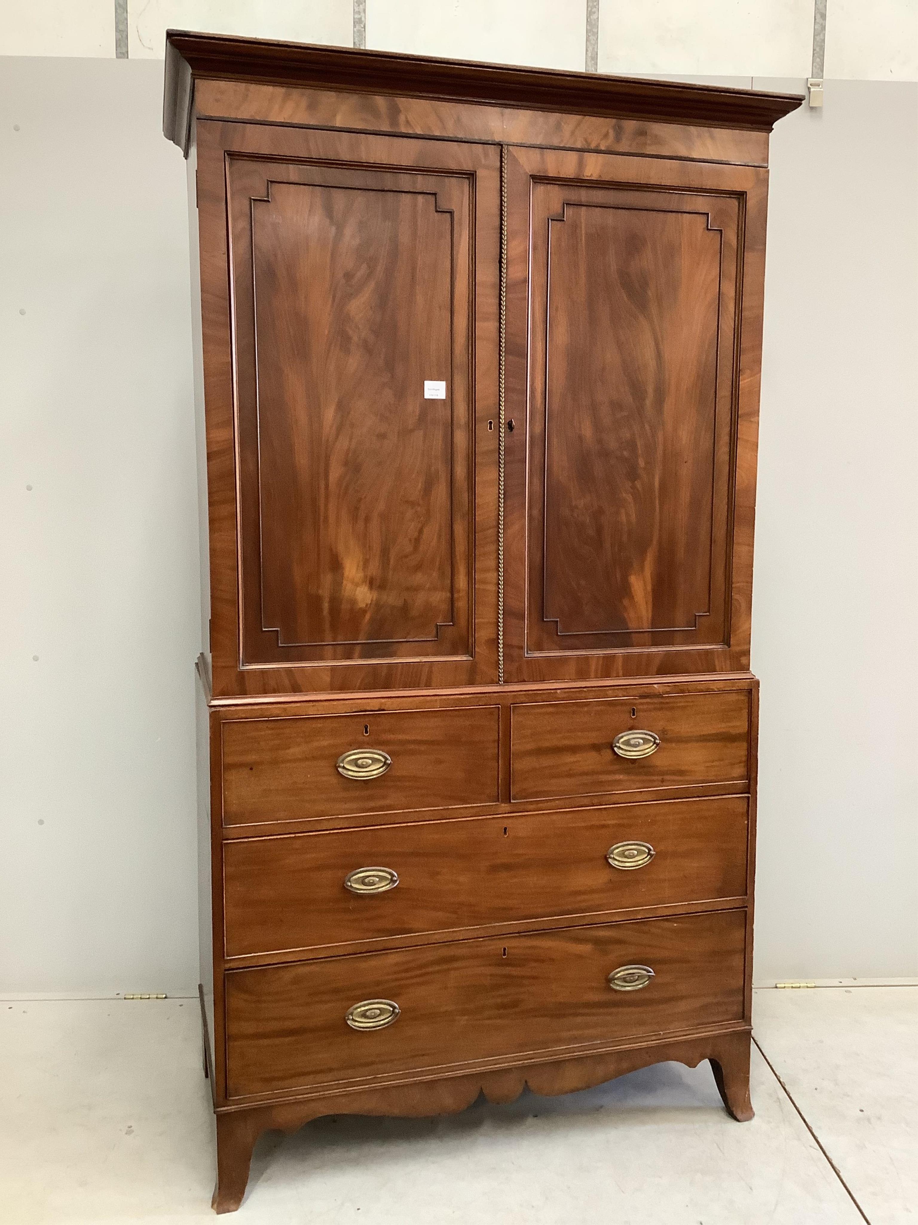 A Regency mahogany linen press, width 120cm, depth 56cm, height 211cm. Condition - fair, interior shelves are later